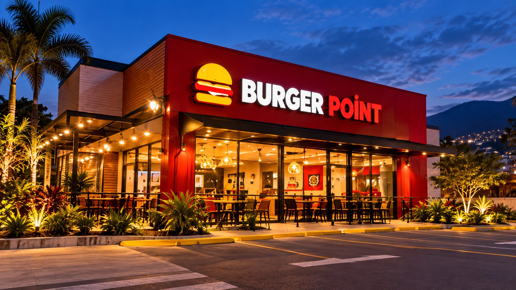 Exterior iluminado de Burger Point Escazú al atardecer